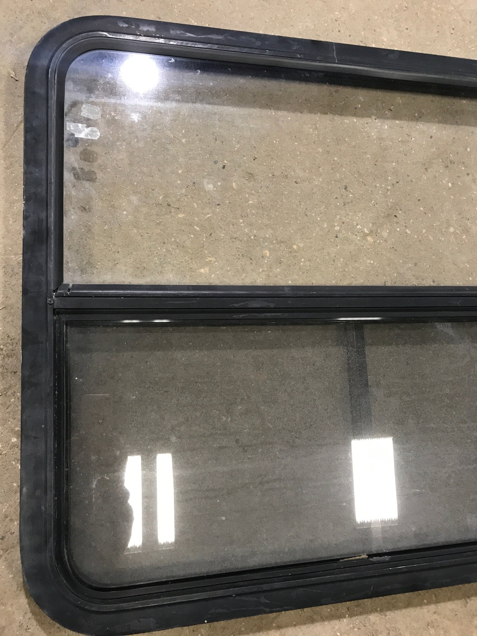 Used Black Radius Opening Window : 34 1/2" W x 29 1/2" H x 1 7/8" D - Young Farts RV Parts