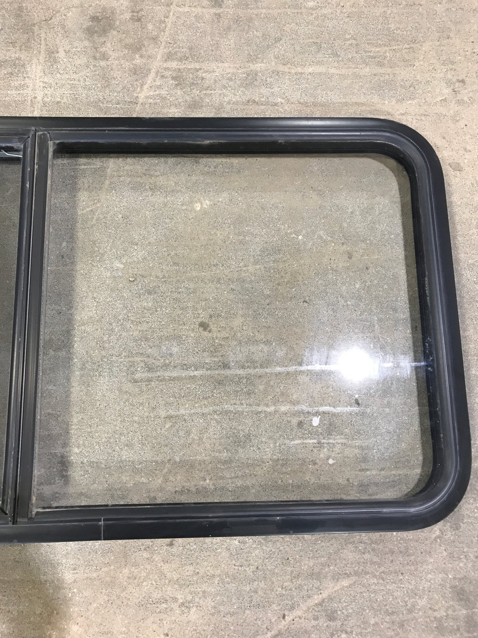 Used Black Radius Opening Window : 34 3/4" W x 23 1/4" H x 2" D - Young Farts RV Parts