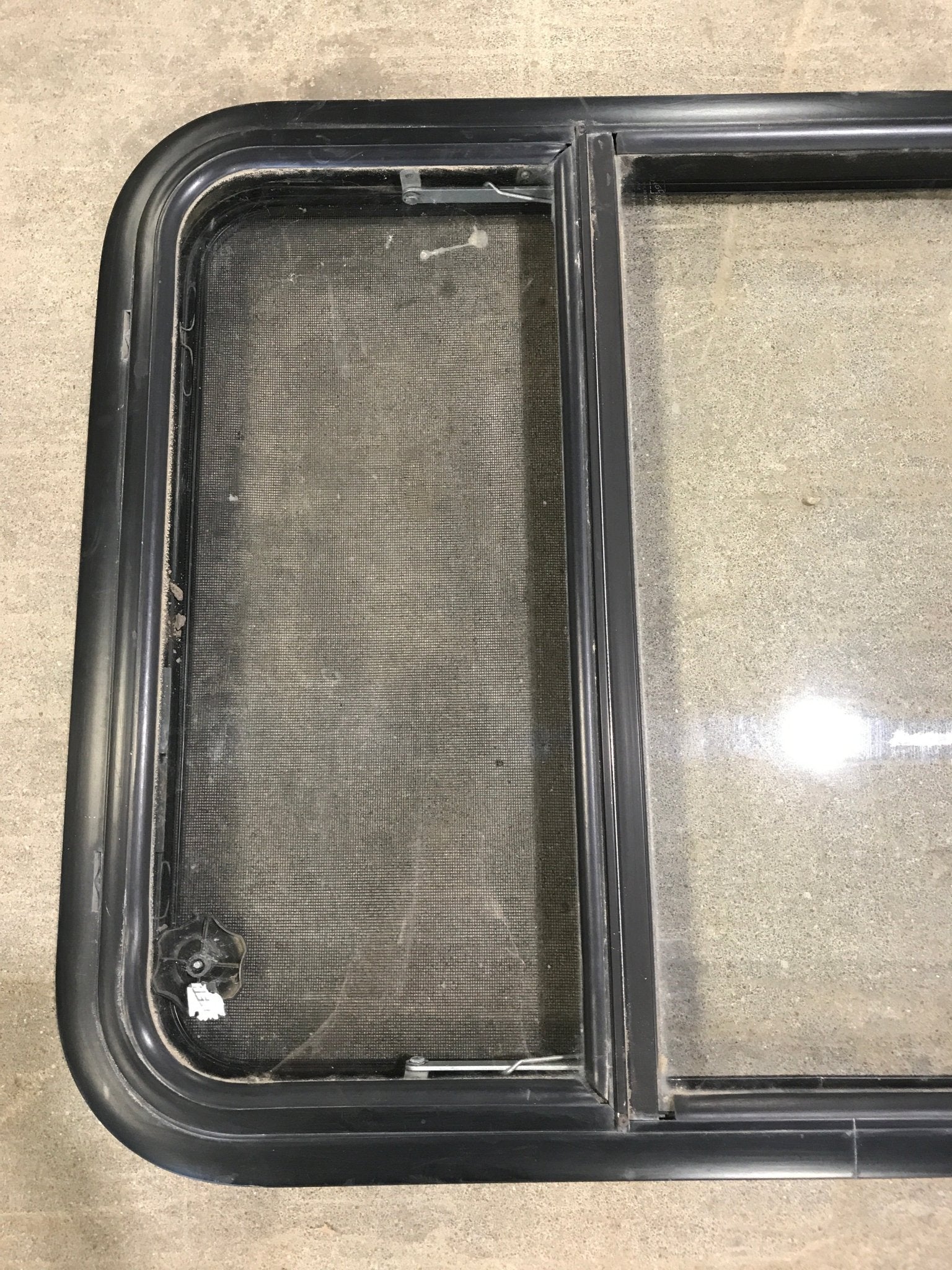 Used Black Radius Opening Window : 34 3/4" W x 23 1/4" H x 2" D - Young Farts RV Parts