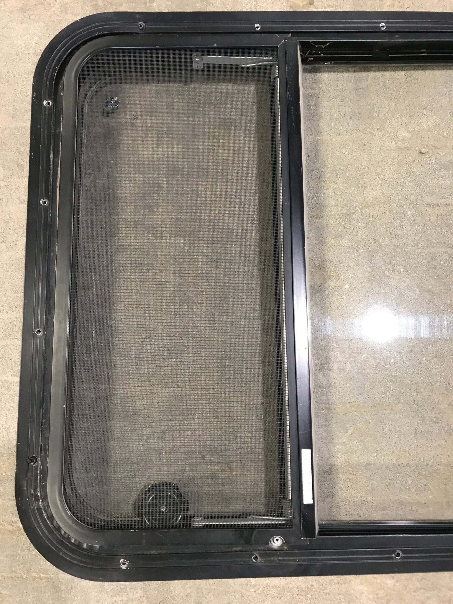 Used Black Radius Opening Window : 34 3/4" W x 23 1/4" H x 2" D - Young Farts RV Parts