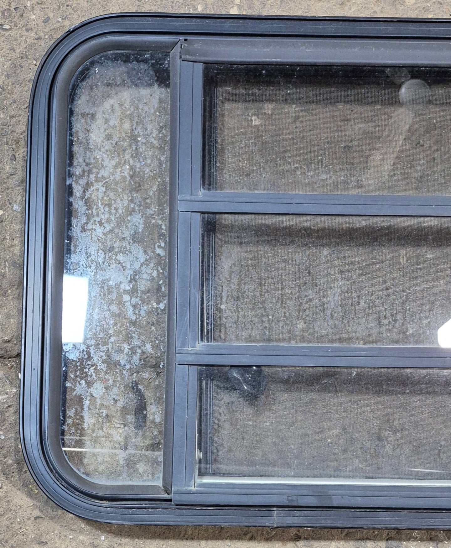 Used Black Radius Opening Window : 35 1/2" W x 21 3/4" H x 1 7/8" - Young Farts RV Parts