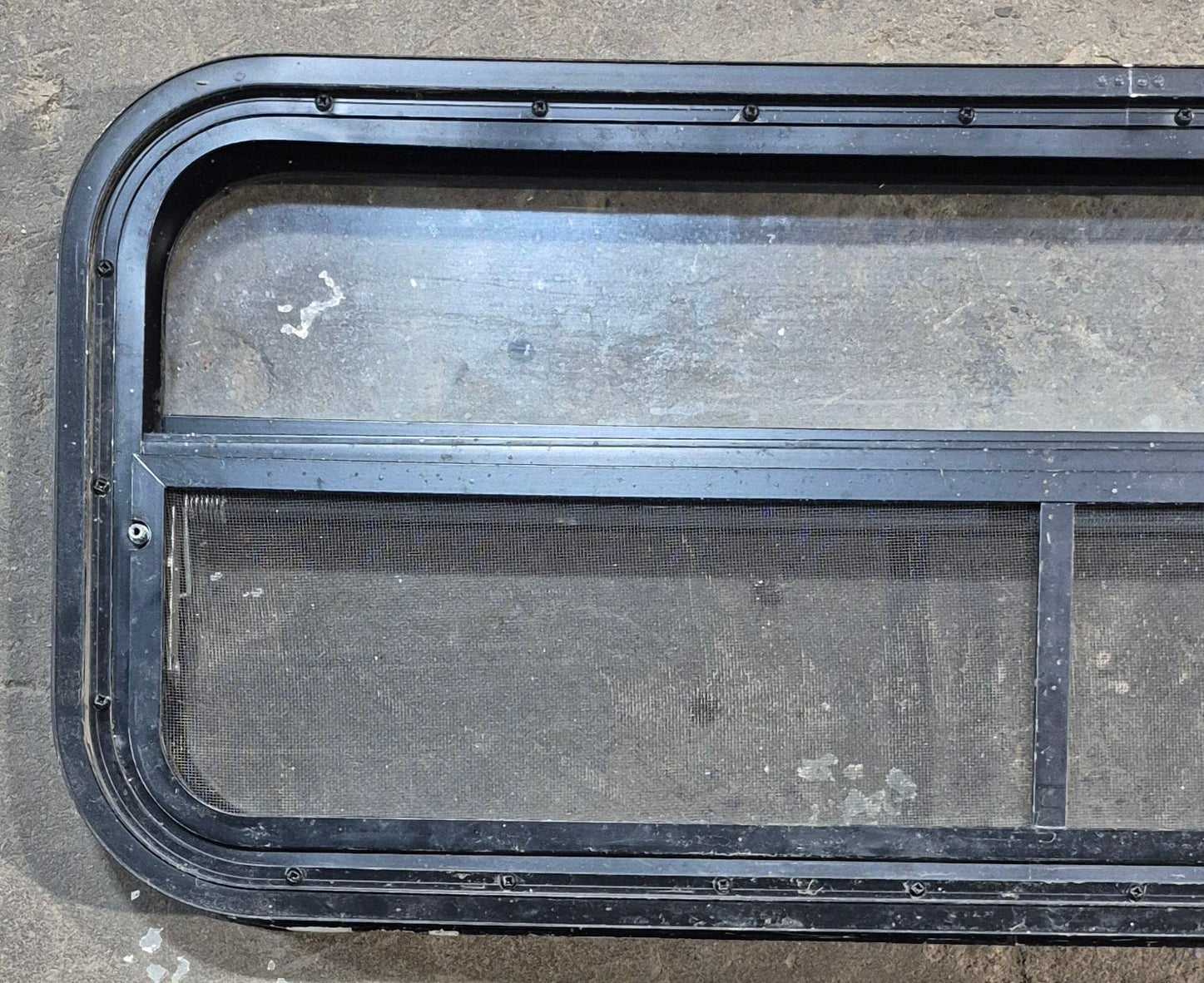 Used Black Radius Opening Window : 35 1/4" W x 14 1/4" H x 1 7/8" - Young Farts RV Parts