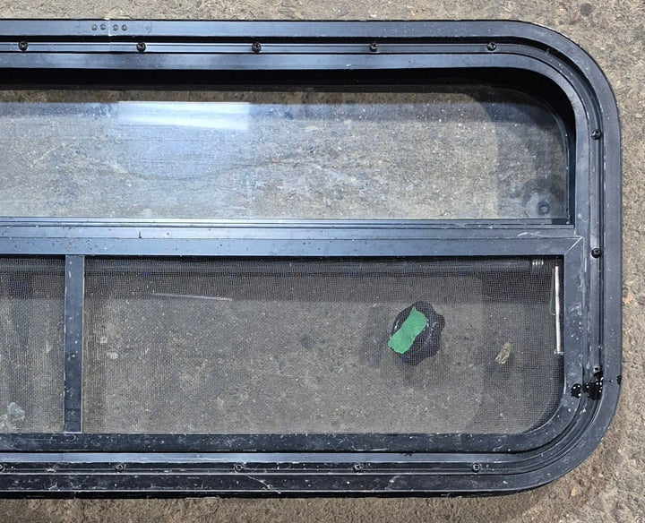 Used Black Radius Opening Window : 35 1/4" W x 14 1/4" H x 1 7/8" - Young Farts RV Parts