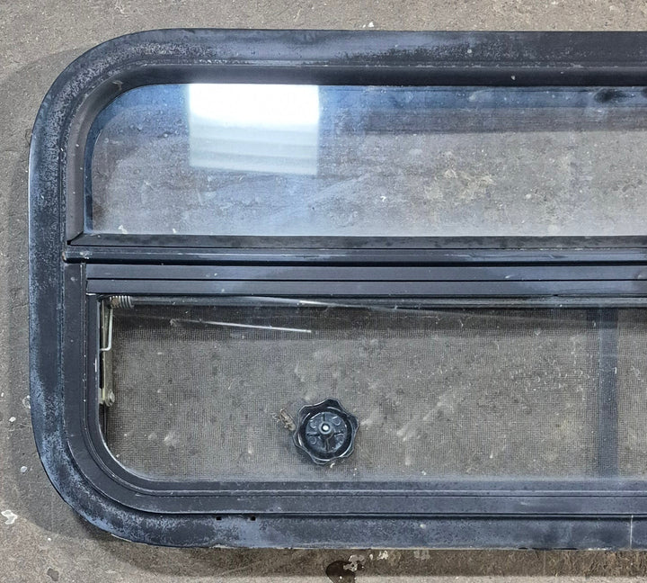Used Black Radius Opening Window : 35 1/4" W x 14 1/4" H x 1 7/8" - Young Farts RV Parts