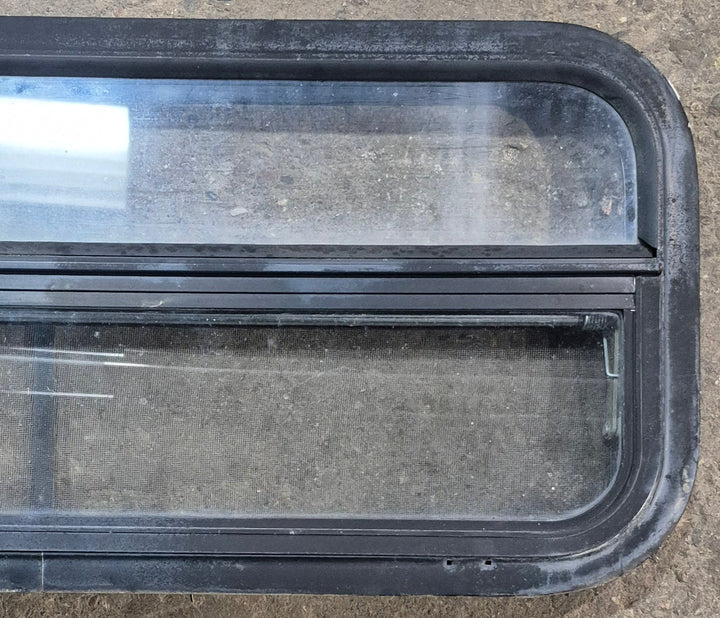 Used Black Radius Opening Window : 35 1/4" W x 14 1/4" H x 1 7/8" - Young Farts RV Parts