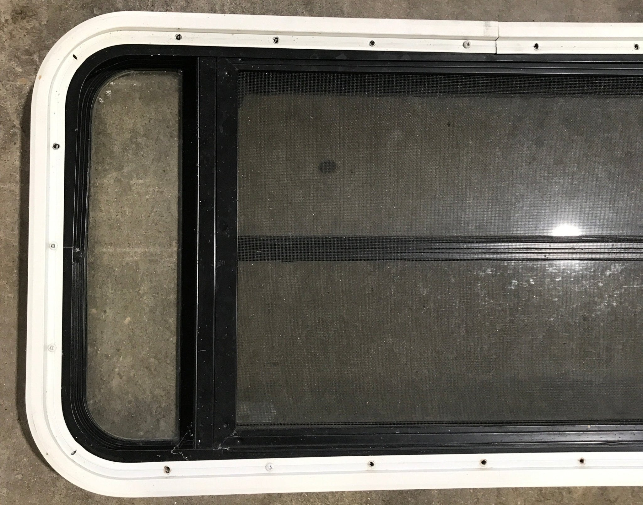 Used Black Radius Opening Window : 35" W x 17 1/4" H x 1 7/8" D - Young Farts RV Parts
