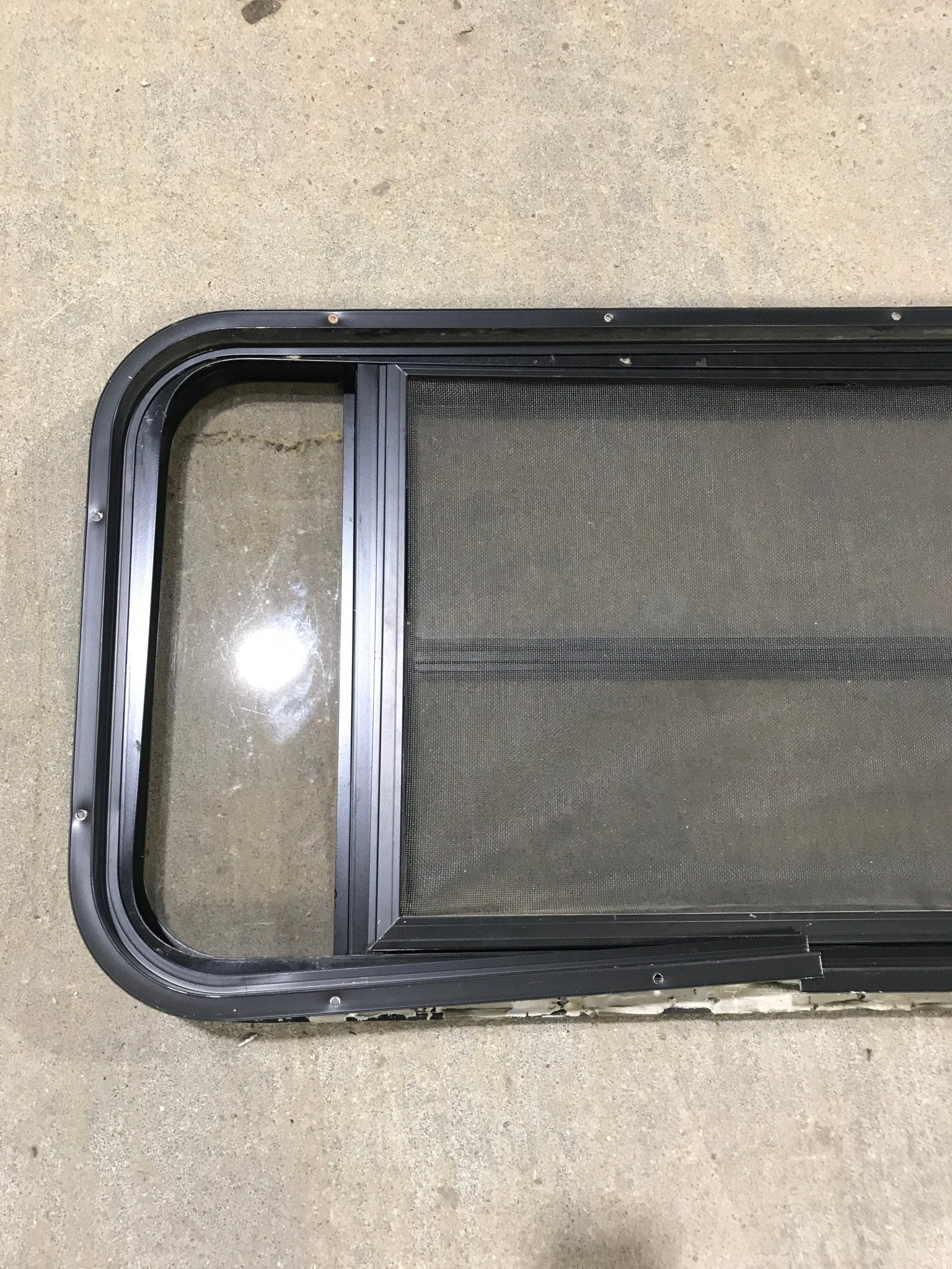 Used Black Radius Opening Window : 37" W x 19 1/4" H x 1 1/4" - Young Farts RV Parts