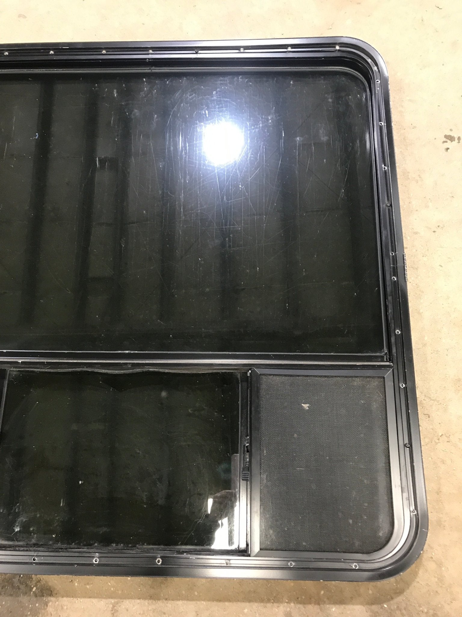 Used Black Radius Opening Window : 39 1/2" W x 39 1/2" H x 1 7/8" D - Young Farts RV Parts