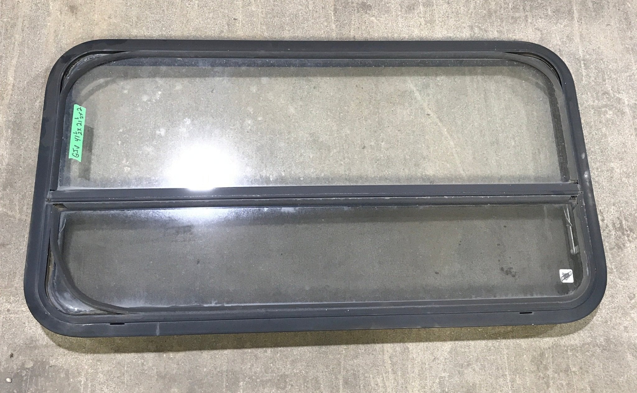 Used Black Radius Opening Window : 41 1/2" W x 21 1/2" H x 2" D - Young Farts RV Parts