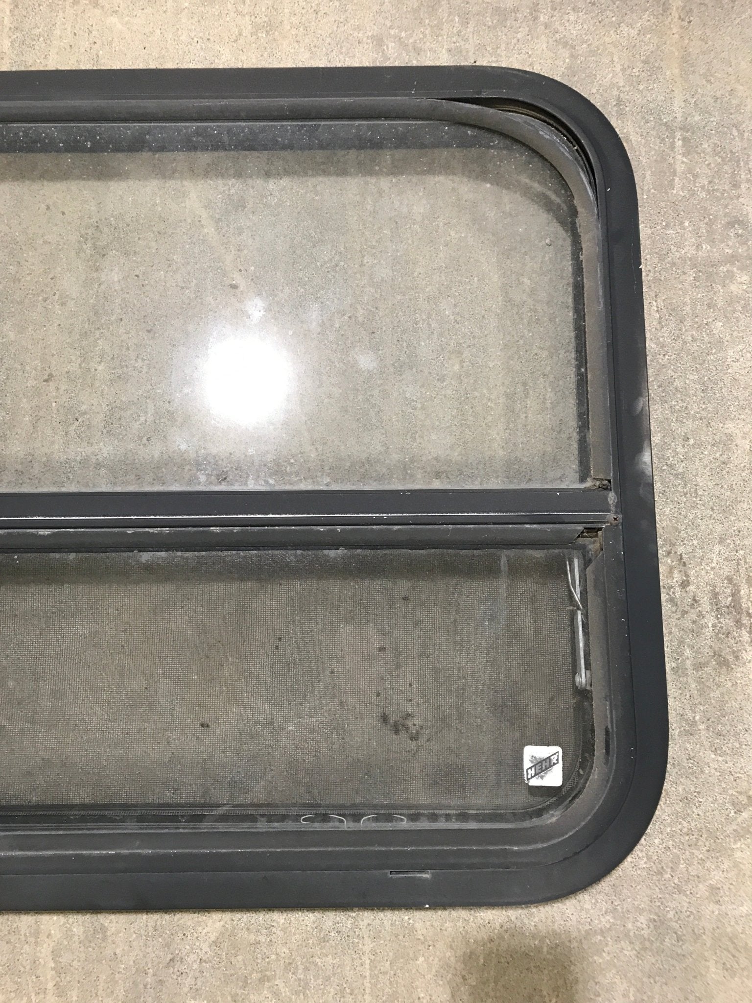 Used Black Radius Opening Window : 41 1/2" W x 21 1/2" H x 2" D - Young Farts RV Parts