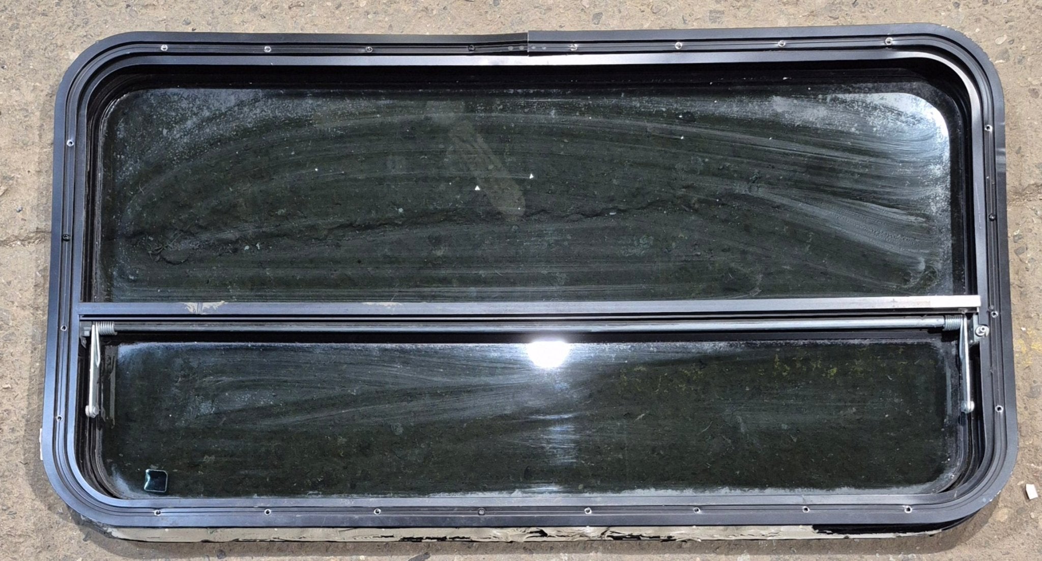 Used Black Radius Opening Window : 41 1/4" W x 21 1/4" H x 2" - Young Farts RV Parts