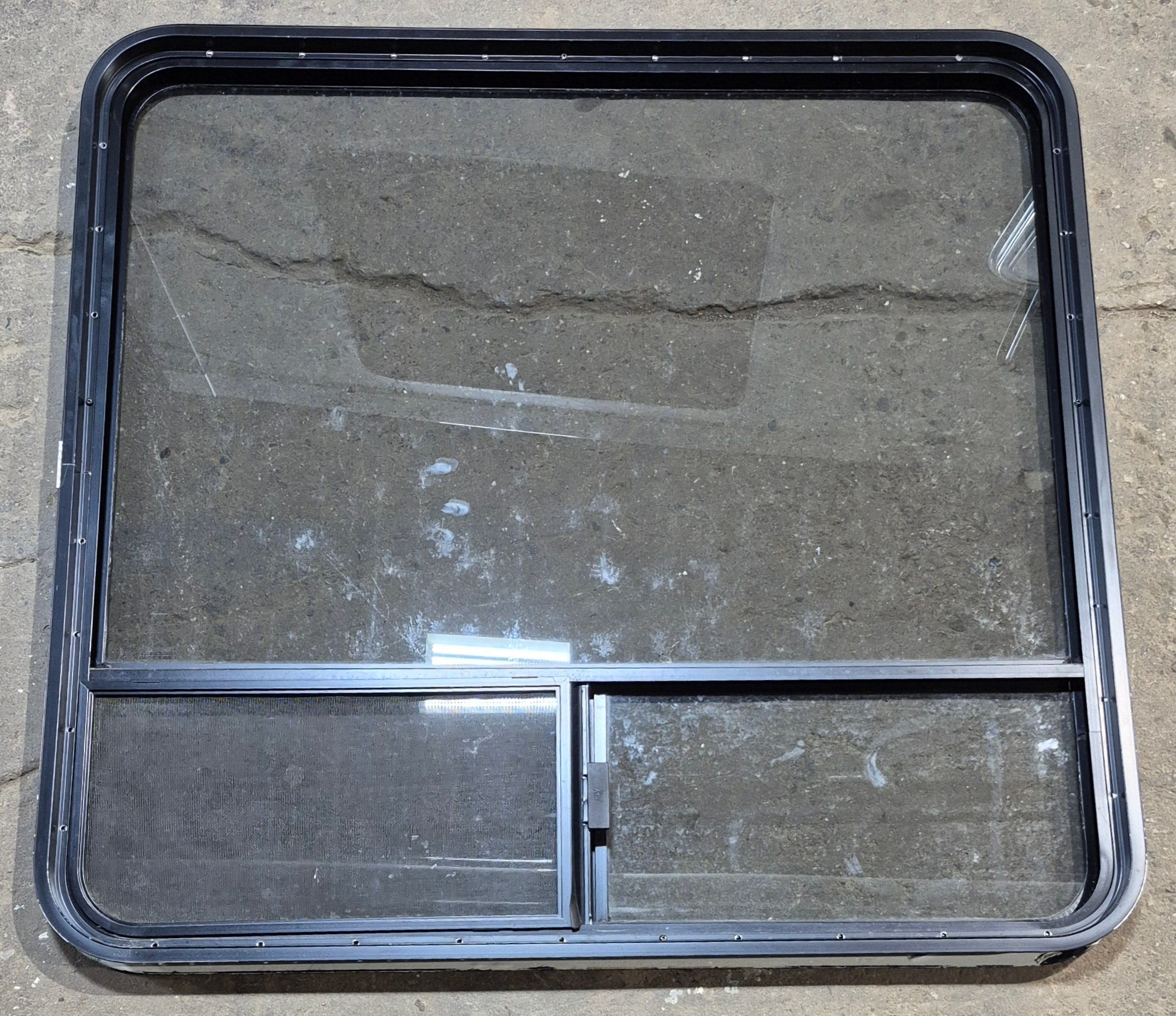 Used Black Radius Opening Window : 41 1/4" W x 39 1/2" H x 1 3/4" - Young Farts RV Parts
