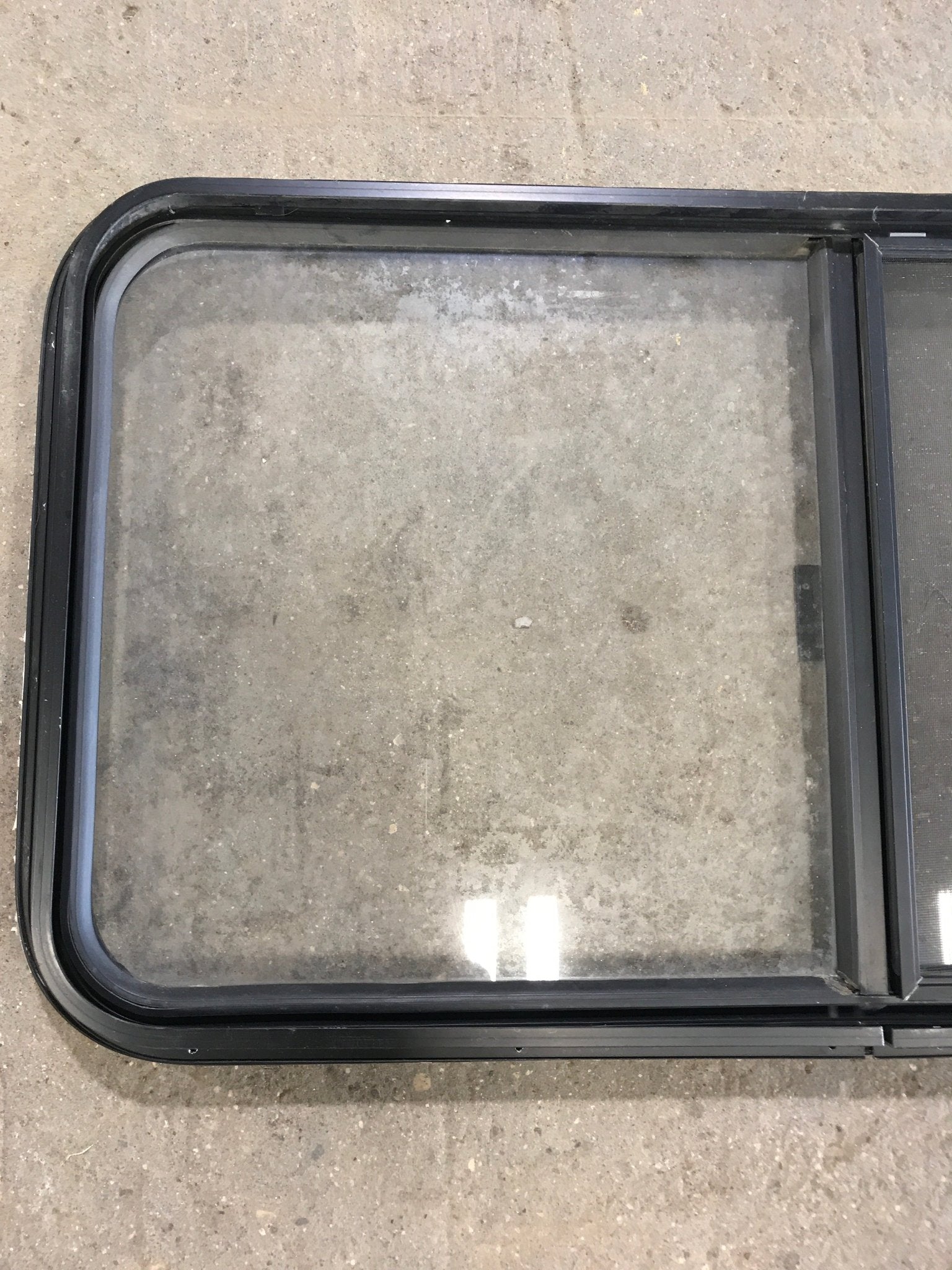 Used Black Radius Opening Window : 42 1/2" W x 22 1/2" H x 2" D - Young Farts RV Parts