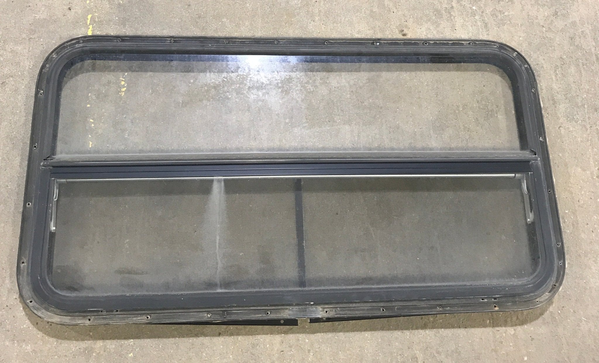Used Black Radius Opening Window : 42 1/2" W x 22 1/2" H x 2" D - Young Farts RV Parts