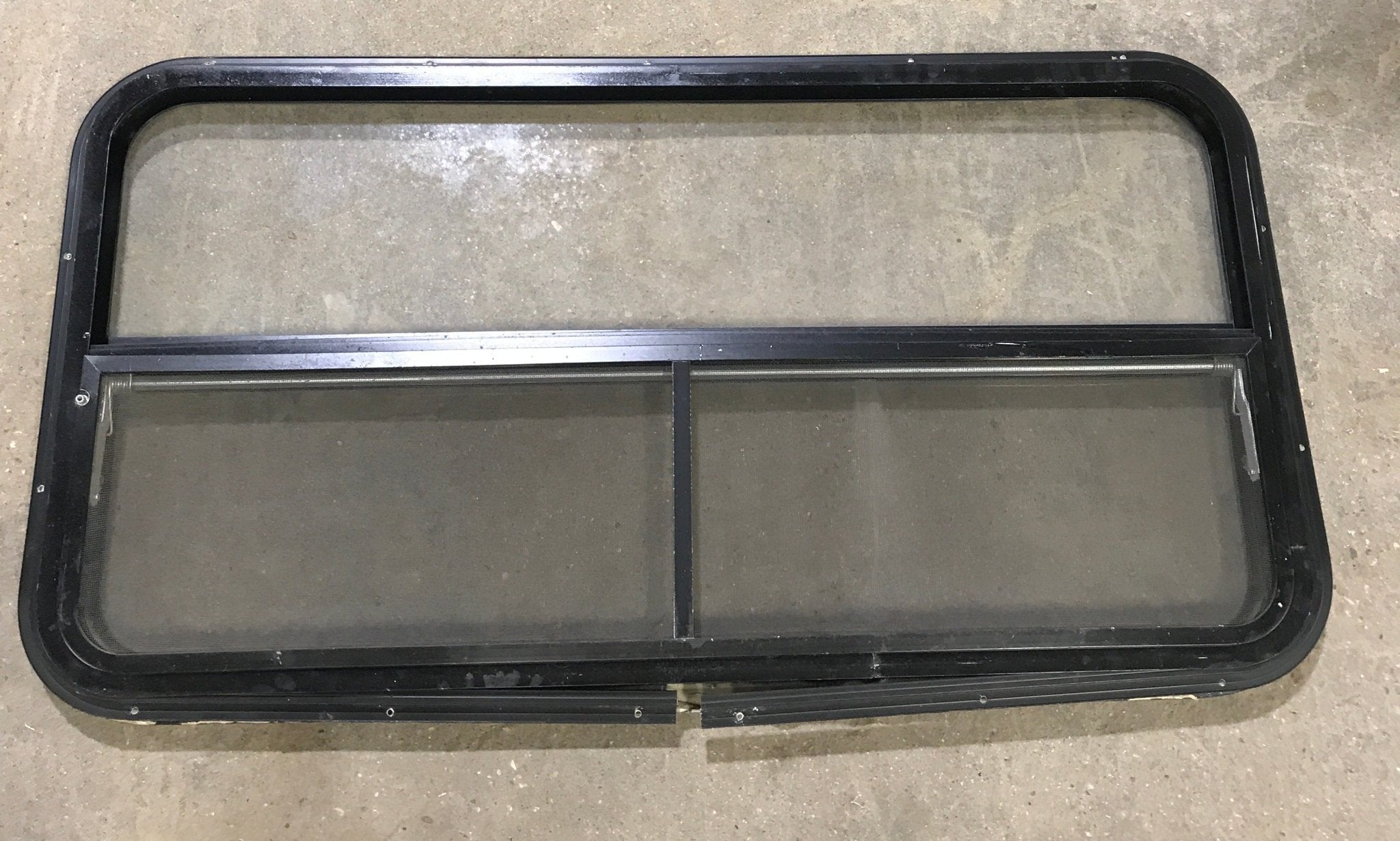 Used Black Radius Opening Window : 42 1/2" W x 22 1/2" H x 2" D - Young Farts RV Parts
