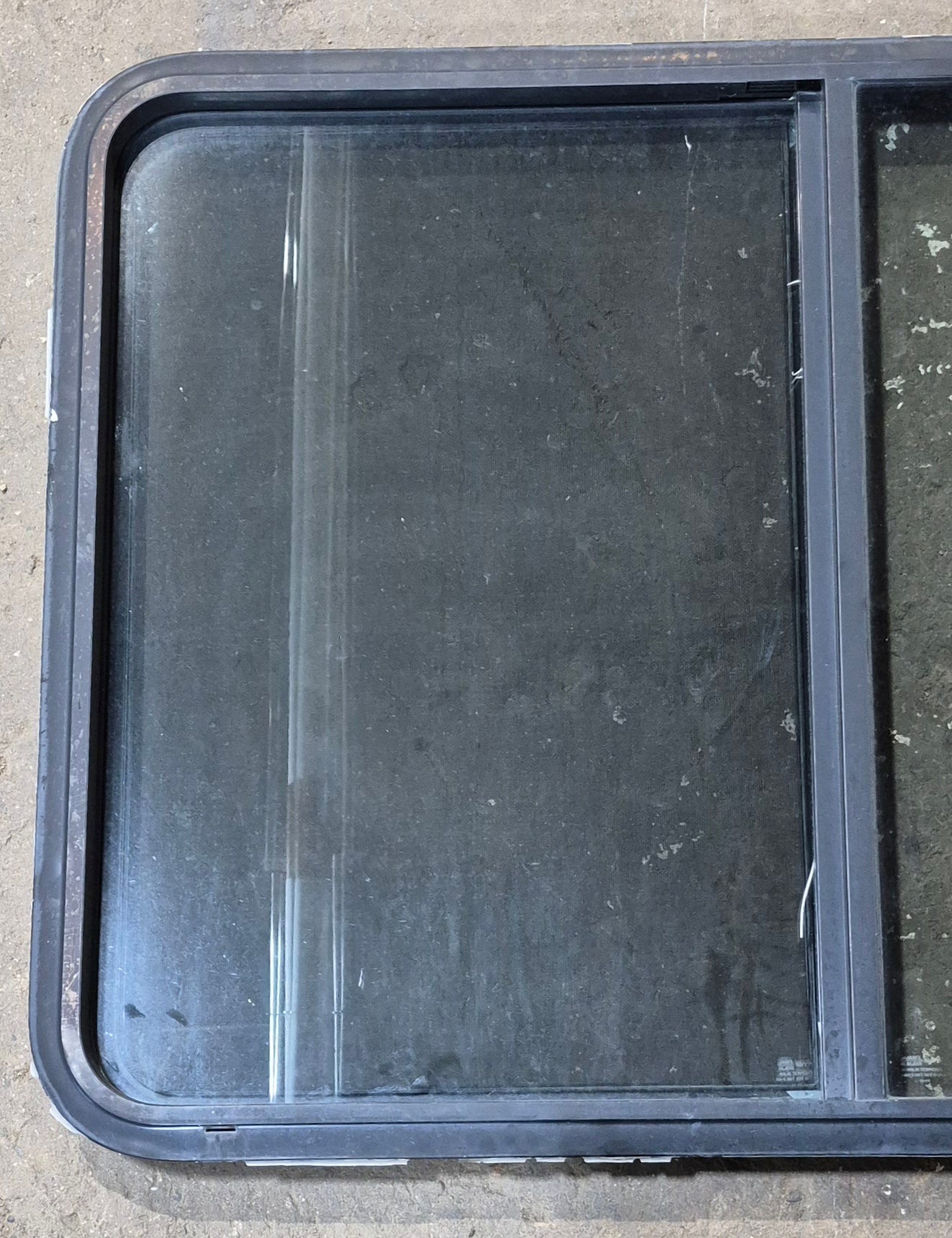 Used Black Radius Opening Window : 42 1/2" W x 34" H x 1 3/4" D - Young Farts RV Parts