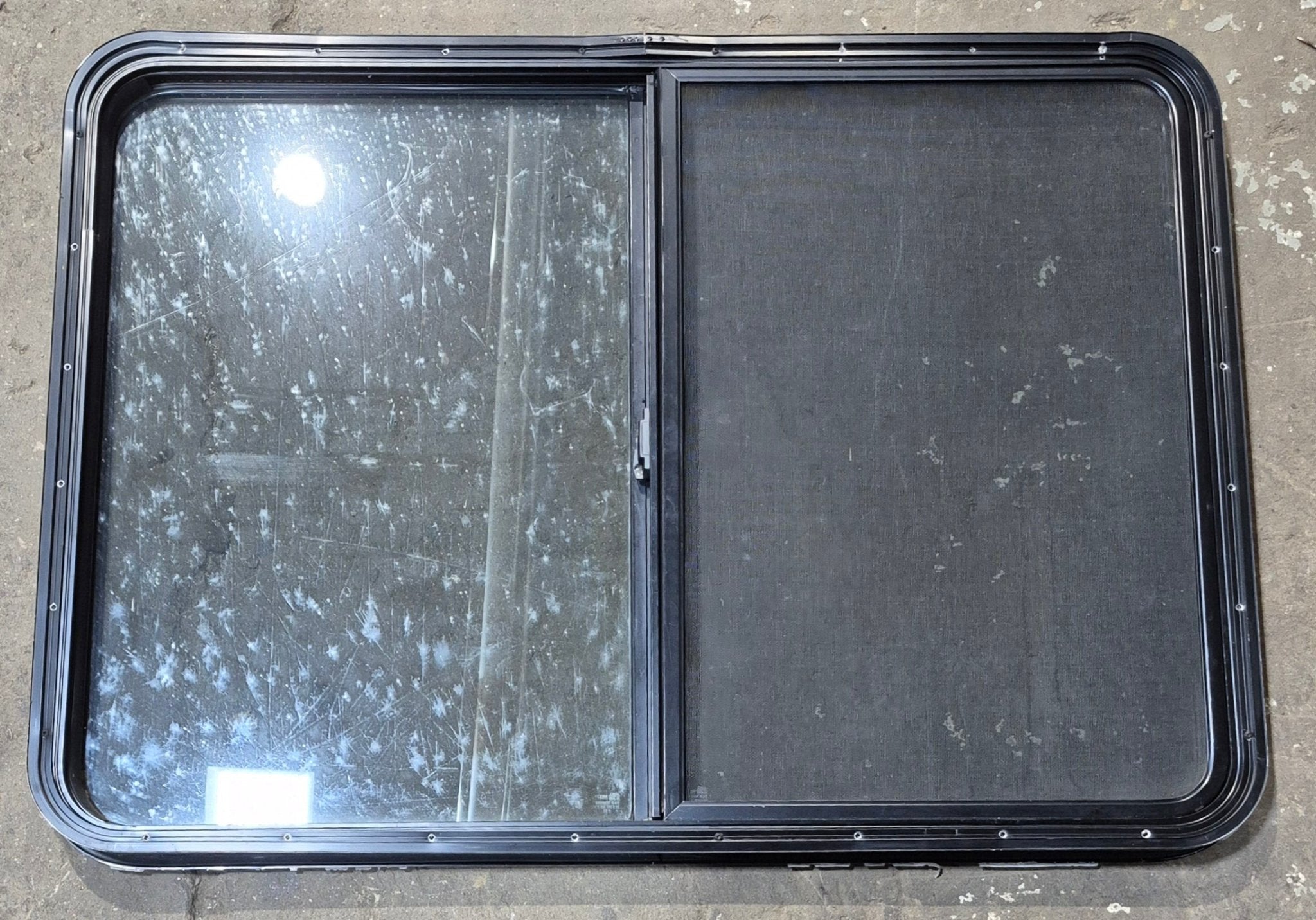 Used Black Radius Opening Window : 42 1/2" W x 34" H x 1 3/4" D - Young Farts RV Parts
