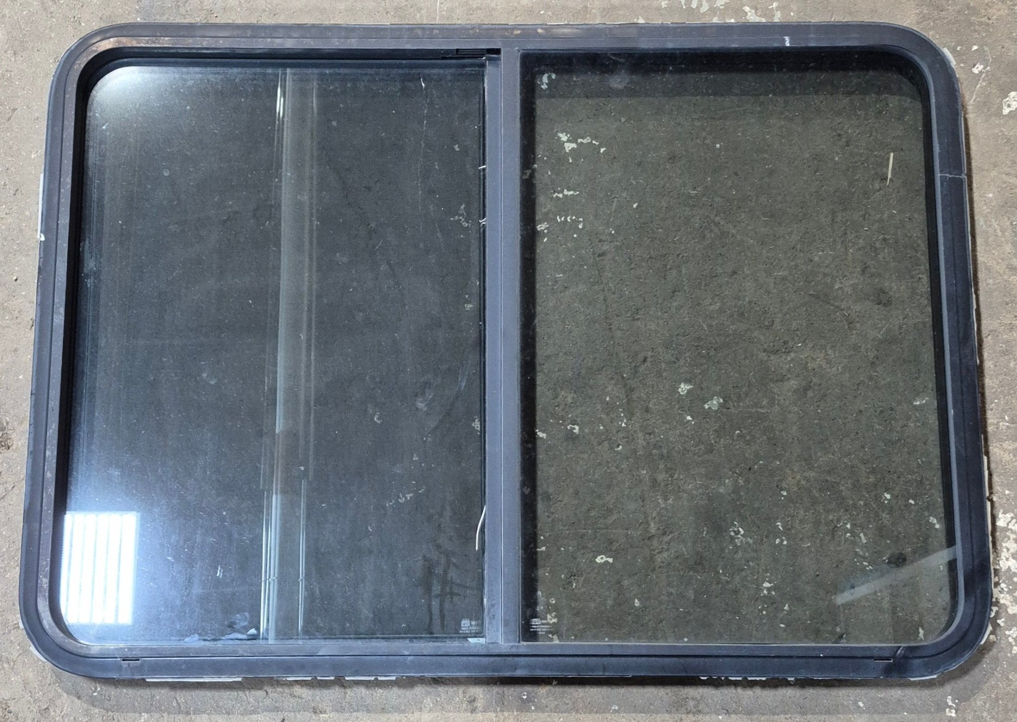 Used Black Radius Opening Window : 42 1/2" W x 34" H x 1 3/4" D - Young Farts RV Parts