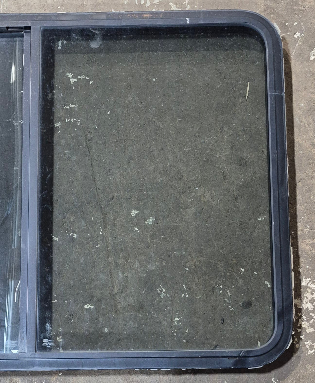 Used Black Radius Opening Window : 42 1/2" W x 34" H x 1 3/4" D - Young Farts RV Parts