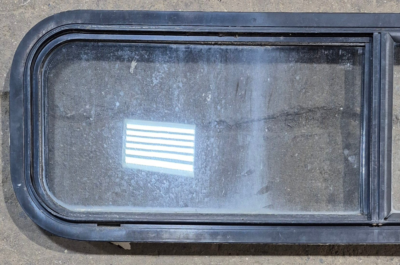 Used Black Radius Opening Window : 42 1/4" W x 11 3/4" H x 1 7/8" - Young Farts RV Parts