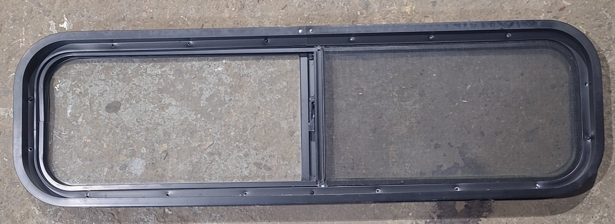 Used Black Radius Opening Window : 42 1/4" W x 11 3/4" H x 1 7/8" D - Young Farts RV Parts