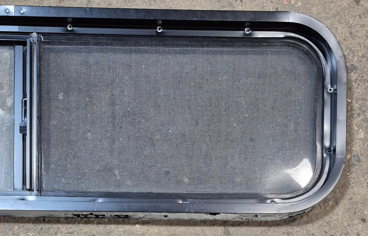 Used Black Radius Opening Window : 42 1/4" W x 11 3/4" H x 2" - Young Farts RV Parts