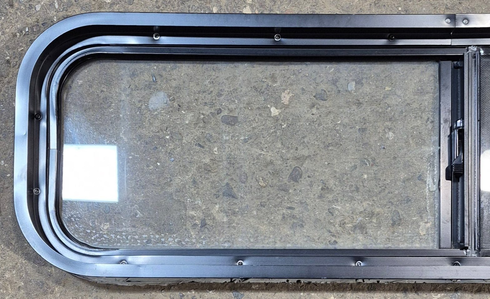 Used Black Radius Opening Window : 42 1/4" W x 11 3/4" H x 2" - Young Farts RV Parts