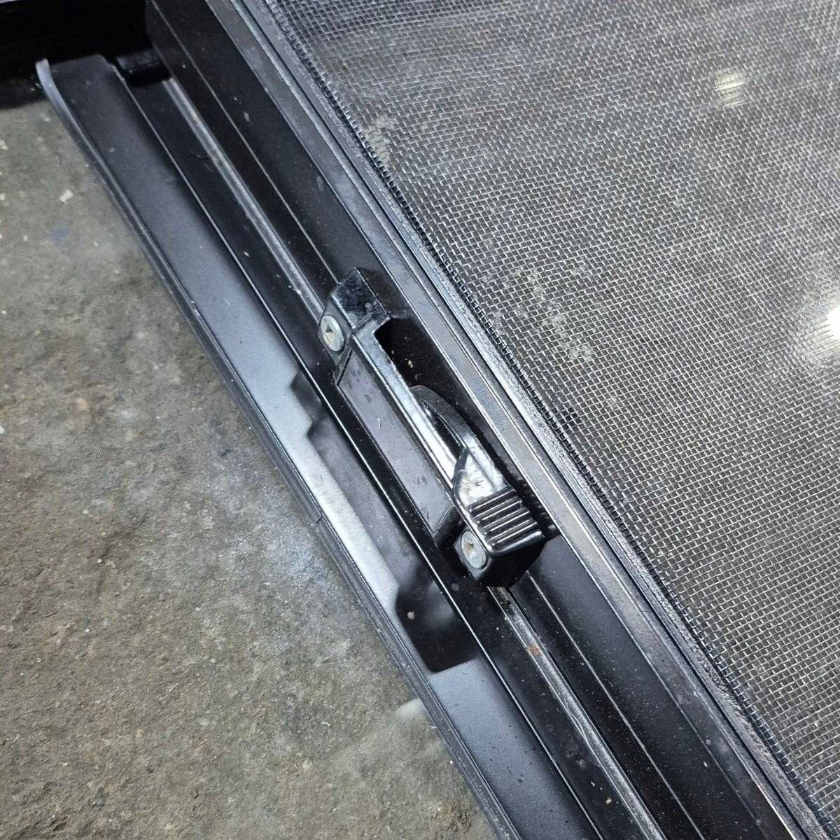 Used Black Radius Opening Window - 42 X 11 3/4 X 2 - Young Farts RV Parts