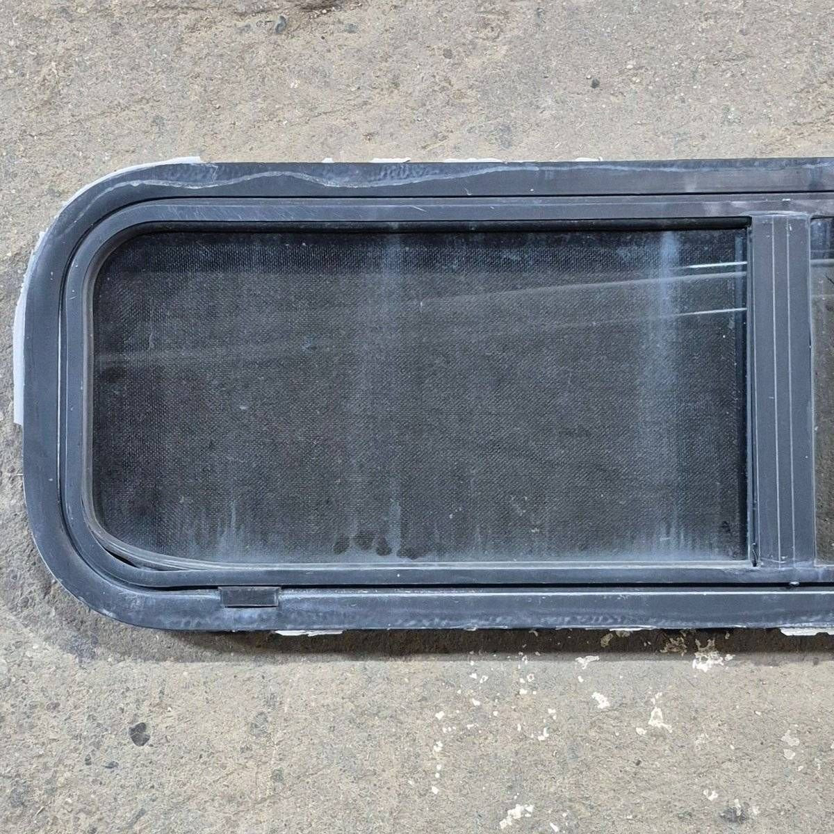 Used Black Radius Opening Window - 42 X 11 3/4 X 2 - Young Farts RV Parts