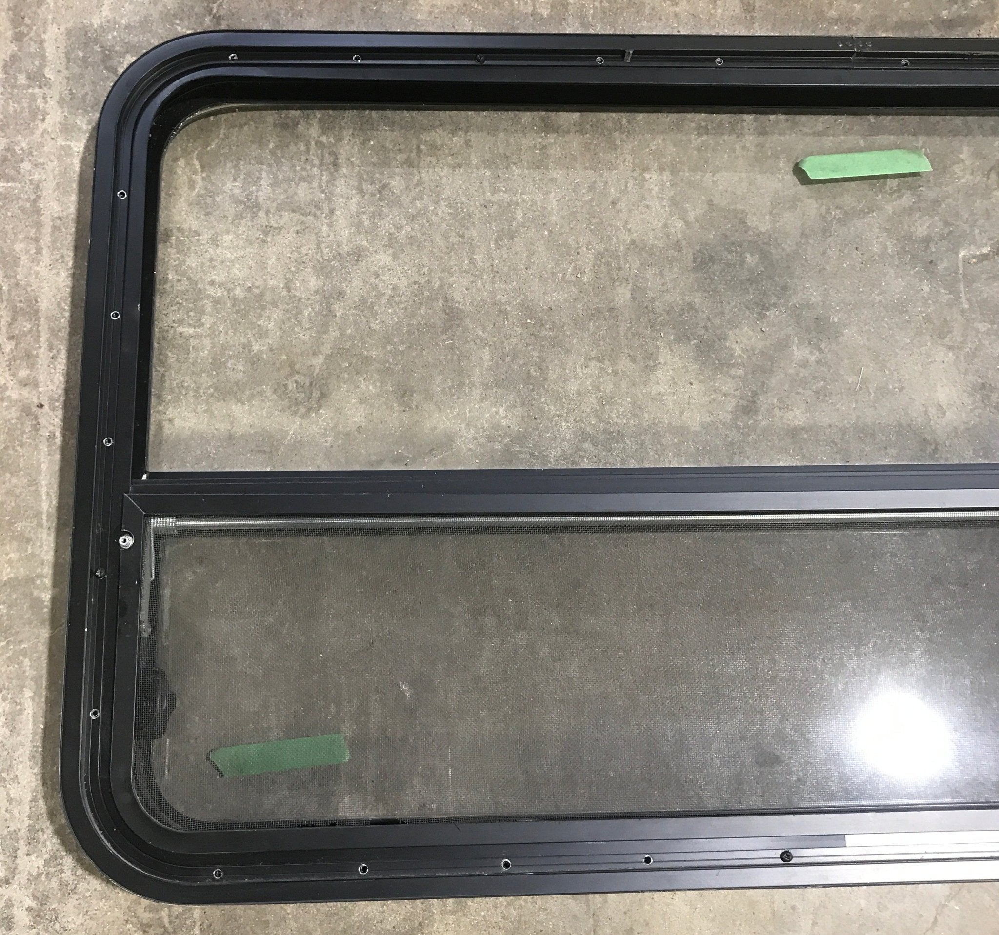 Used Black Radius Opening Window : 45 1/2" W x 25 1/2" H x 2" D - Young Farts RV Parts