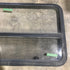 Used Black Radius Opening Window : 45 1/2" W x 25 1/2" H x 2" D - Young Farts RV Parts