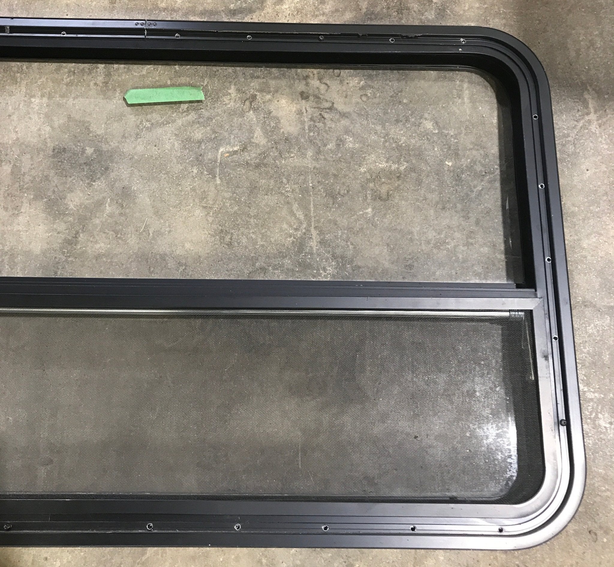Used Black Radius Opening Window : 45 1/2" W x 25 1/2" H x 2" D - Young Farts RV Parts