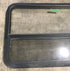 Used Black Radius Opening Window : 45 1/2" W x 25 1/2" H x 2" D - Young Farts RV Parts