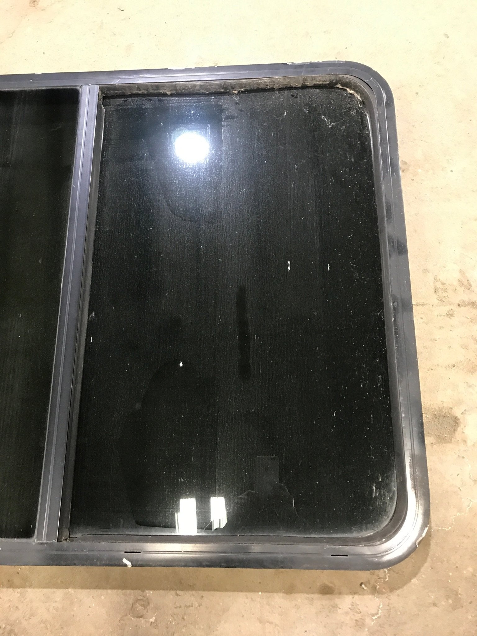 Used Black Radius Opening Window : 45 1/2" W x 34 1/2" H x 1 7/8" D - Young Farts RV Parts
