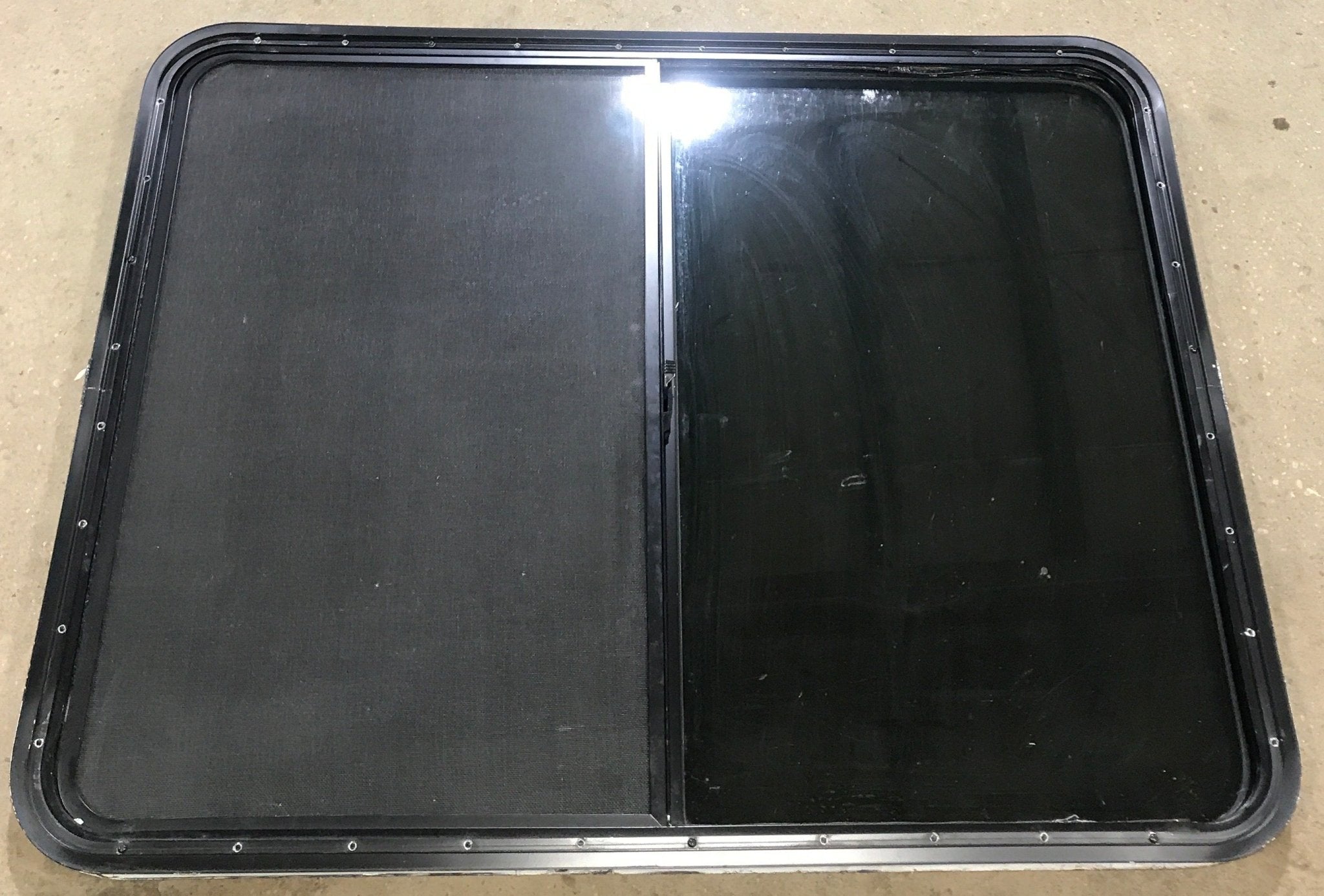 Used Black Radius Opening Window : 45 1/2" W x 34 1/2" H x 1 7/8" D - Young Farts RV Parts