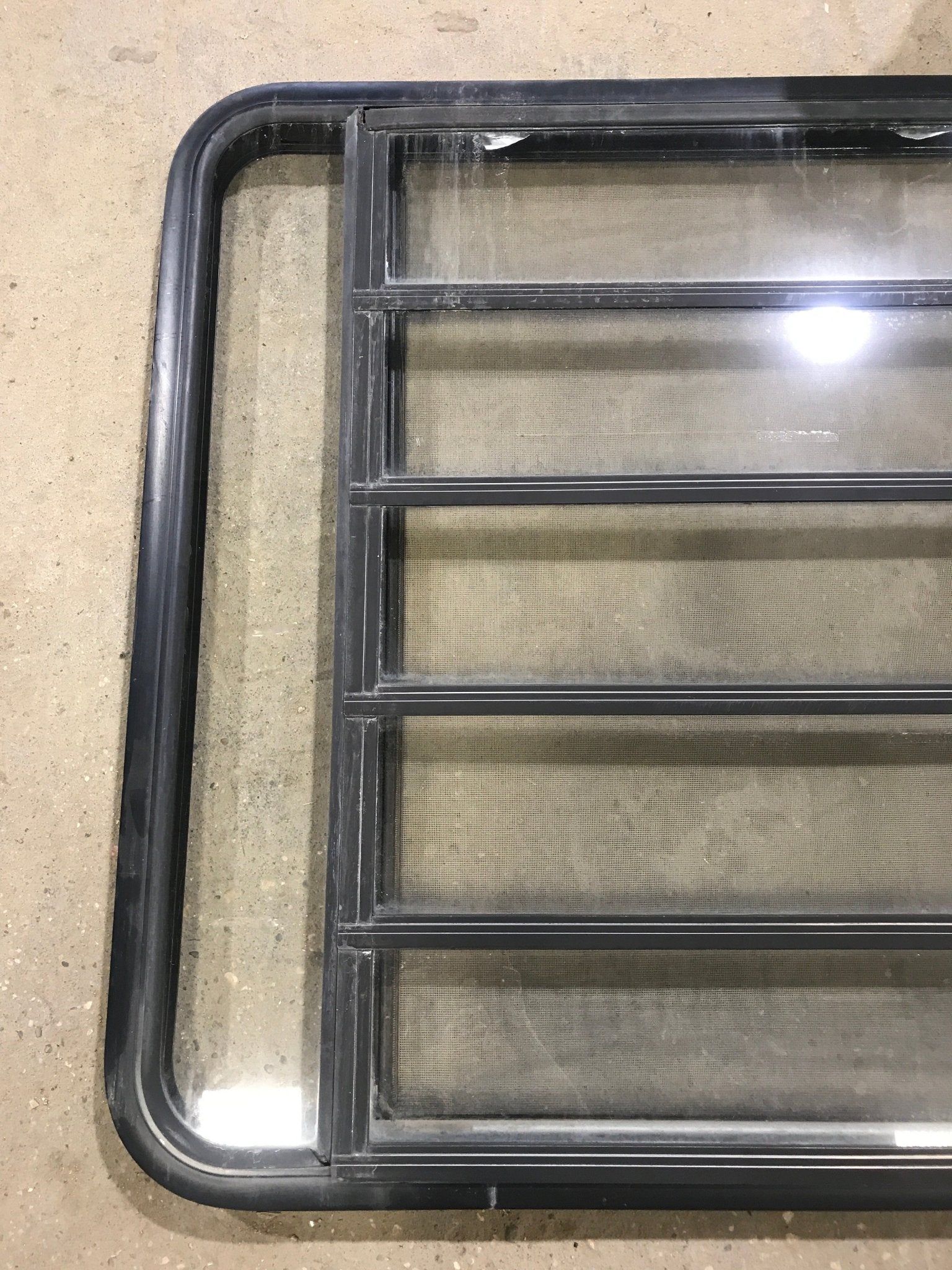Used Black Radius Opening Window : 45 1/2" W x 35 3/4" H x 2" D - Young Farts RV Parts