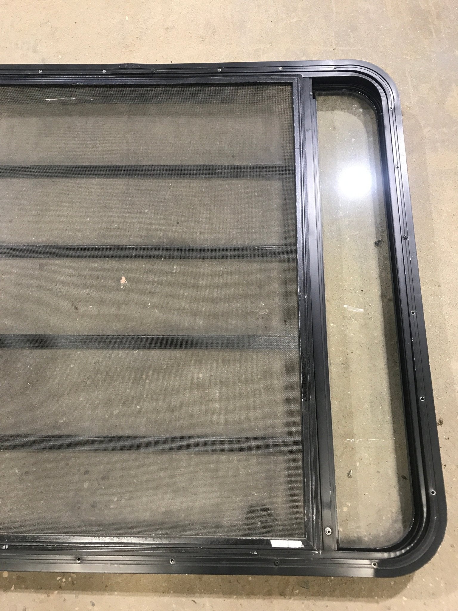 Used Black Radius Opening Window : 45 1/2" W x 35 3/4" H x 2" D - Young Farts RV Parts