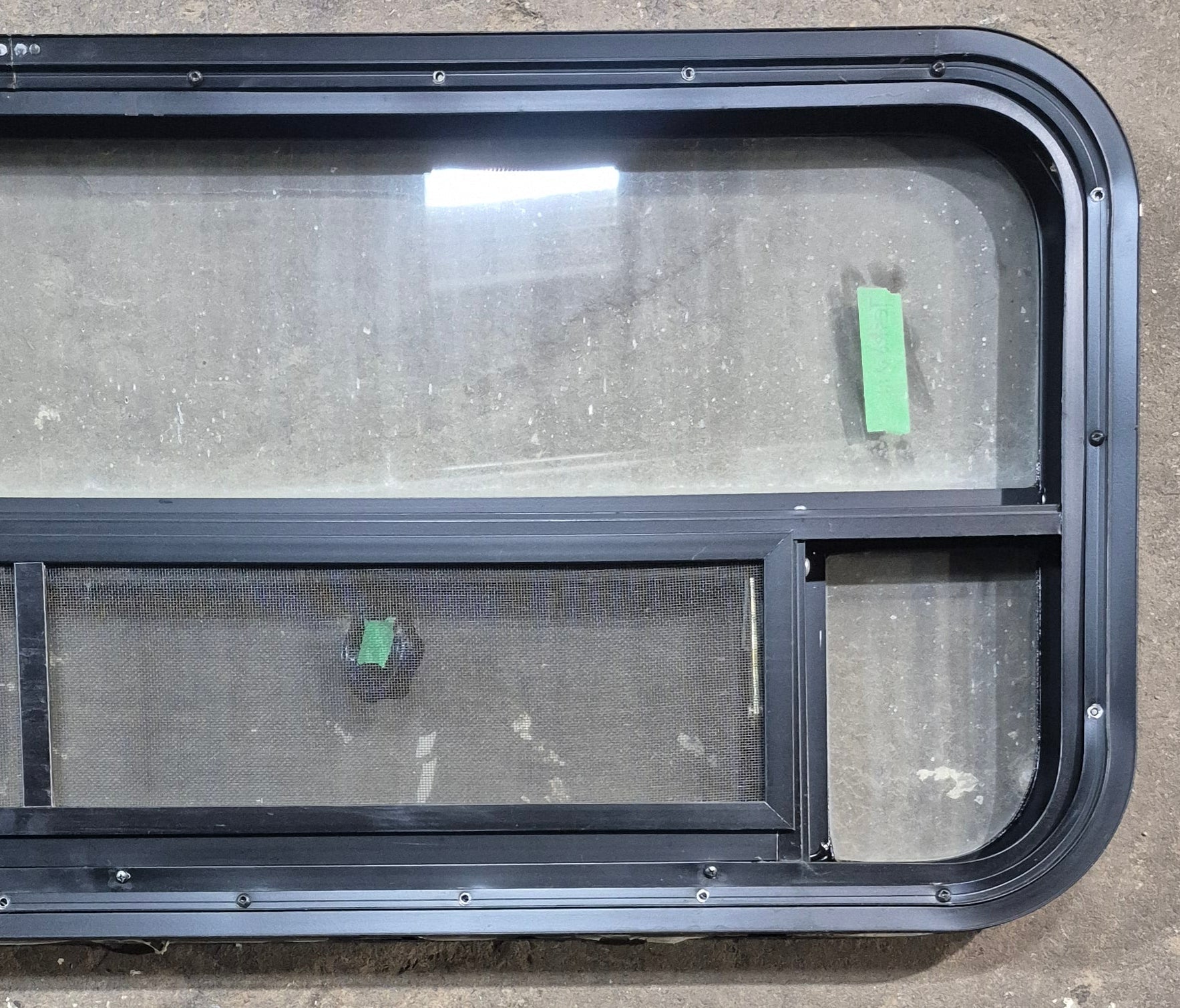 Used Black Radius Opening Window : 45 1/4" W x 17 1/4" H x 1 7/8" D - Young Farts RV Parts