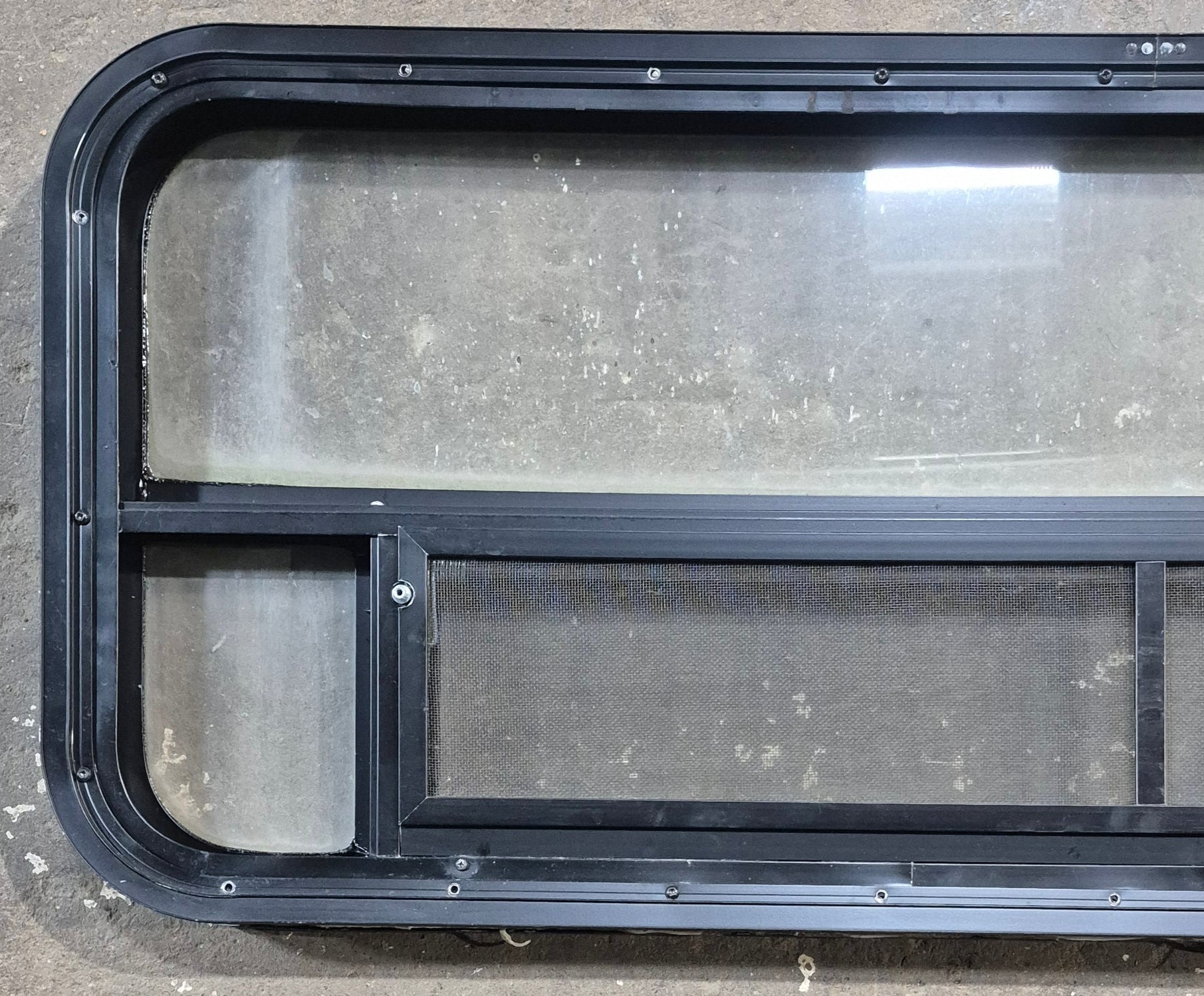 Used Black Radius Opening Window : 45 1/4" W x 17 1/4" H x 1 7/8" D - Young Farts RV Parts