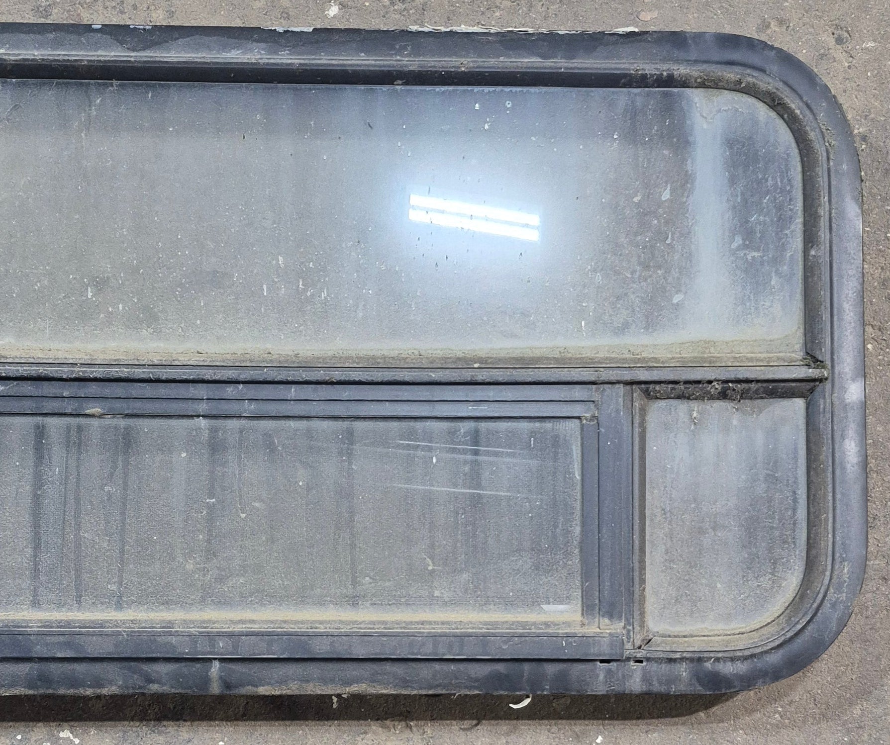 Used Black Radius Opening Window : 45 1/4" W x 17 1/4" H x 1 7/8" D - Young Farts RV Parts