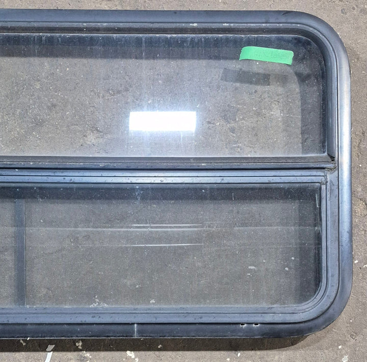 Used Black Radius Opening Window : 45 1/4" W x 21 1/4" H x 1 7/8" D - Young Farts RV Parts