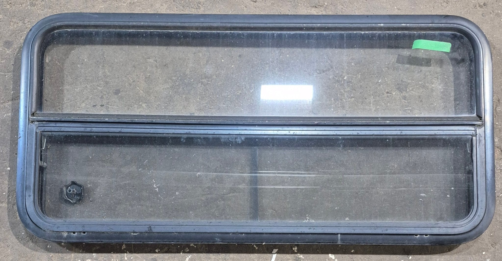 Used Black Radius Opening Window : 45 1/4" W x 21 1/4" H x 1 7/8" D - Young Farts RV Parts