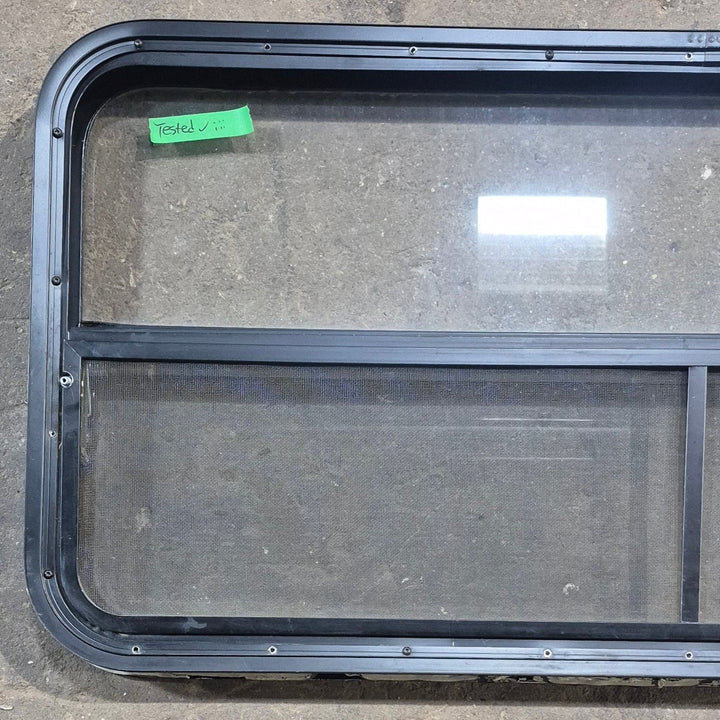 Used Black Radius Opening Window : 45 1/4" W x 21 1/4" H x 1 7/8" D - Young Farts RV Parts