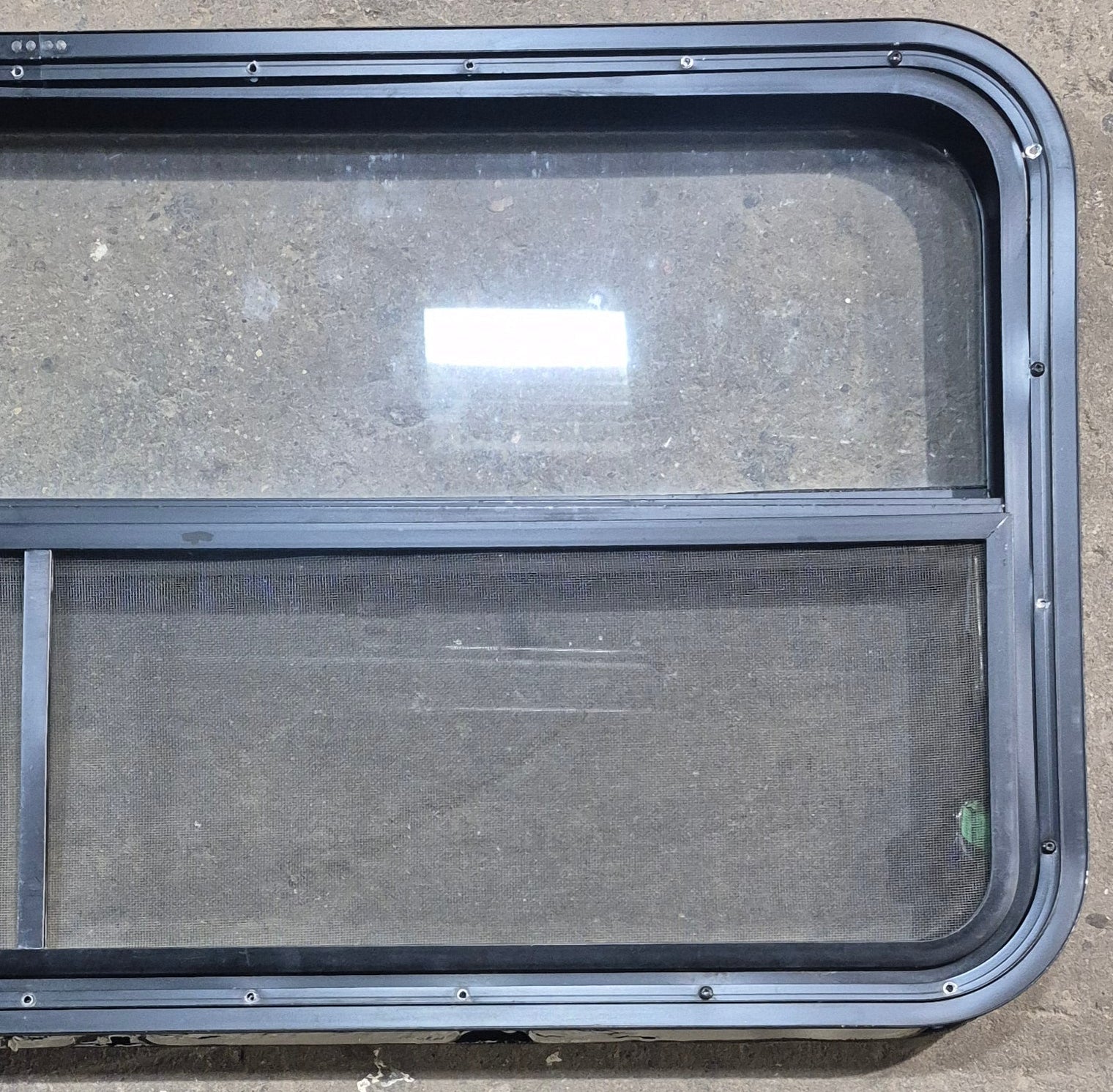 Used Black Radius Opening Window : 45 1/4" W x 21 1/4" H x 1 7/8" D - Young Farts RV Parts