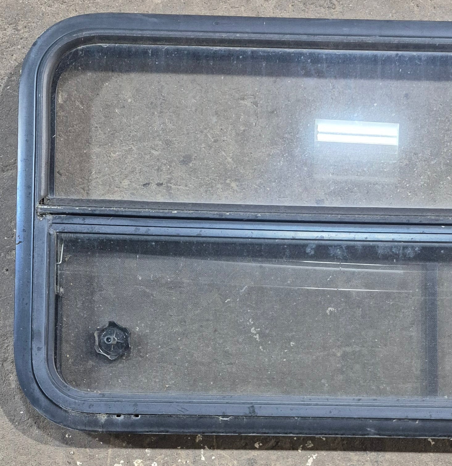 Used Black Radius Opening Window : 45 1/4" W x 21 1/4" H x 1 7/8" D - Young Farts RV Parts