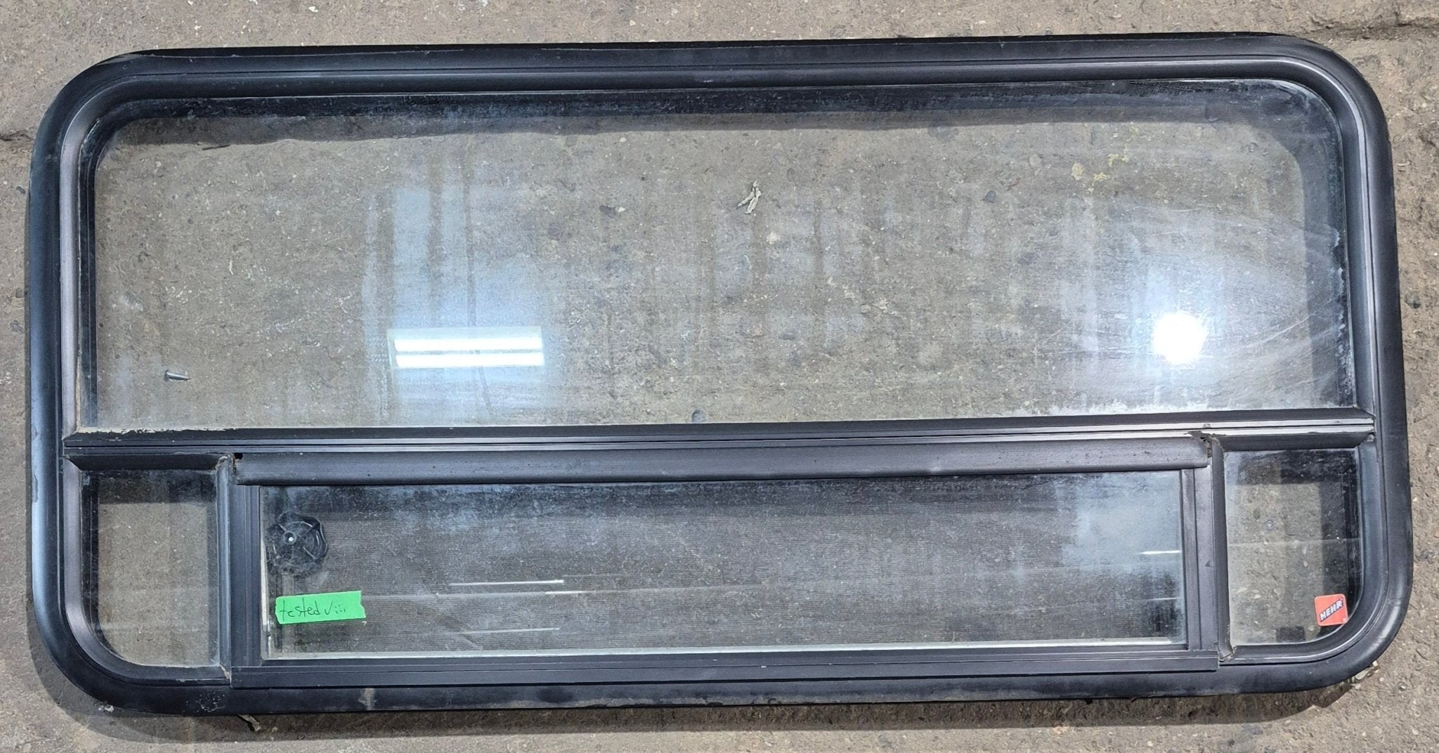 Used Black Radius Opening Window : 45 1/4" W x 21 1/4" H x 1 7/8" D - Young Farts RV Parts