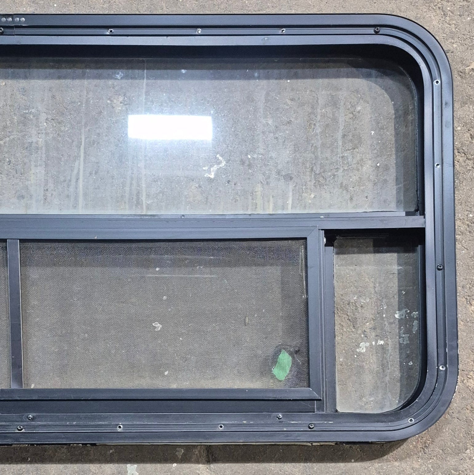 Used Black Radius Opening Window : 45 1/4" W x 21 1/4" H x 1 7/8" D - Young Farts RV Parts