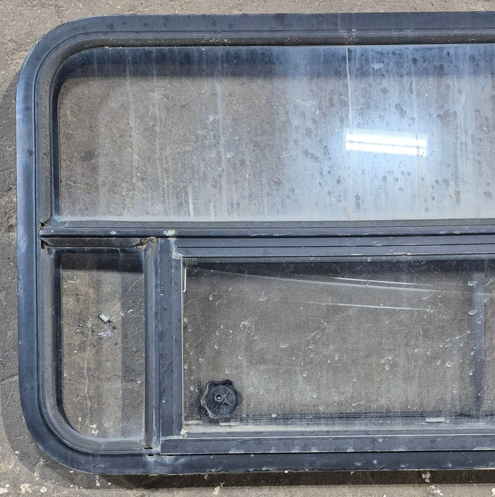 Used Black Radius Opening Window : 45 1/4" W x 21 1/4" H x 1 7/8" D - Young Farts RV Parts