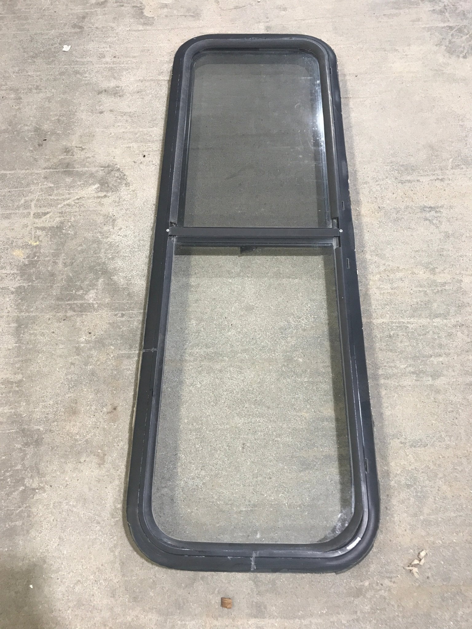Used Black Radius Opening Window : 47 1/2" W x 14 1/2" H x 2" D - Young Farts RV Parts