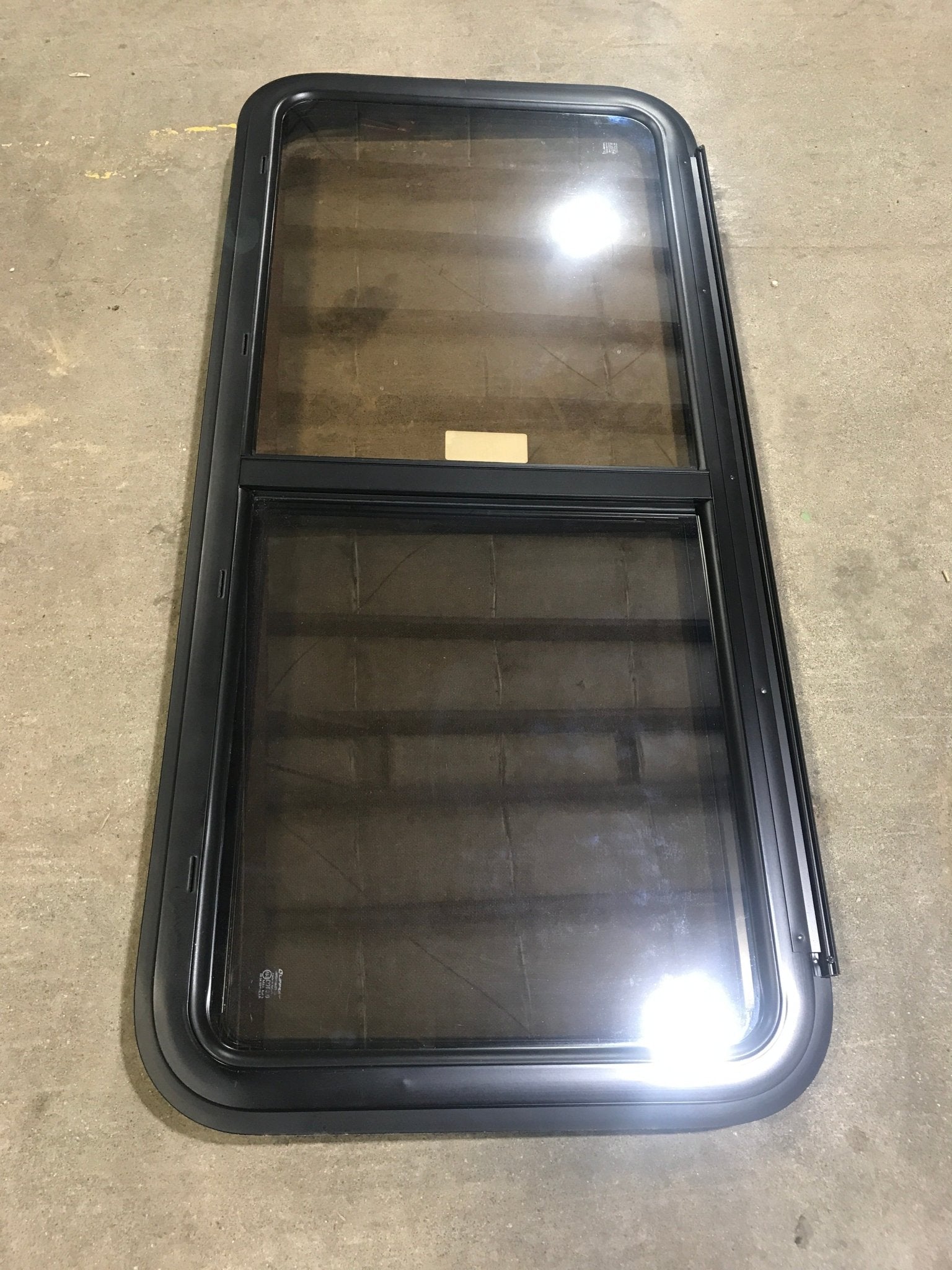 Used Black Radius Opening Window : 47 1/2" W x 21 1/2" H x 1 1/2" D - Young Farts RV Parts
